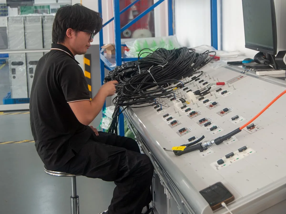 Compliance load testing on a dumbwaiter before shipment, the stage at which dumbwaiter regulations require rated load and safety gear to be verified